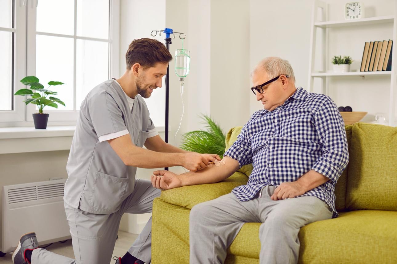 Caring healthcare professional providing in-home support for a patient