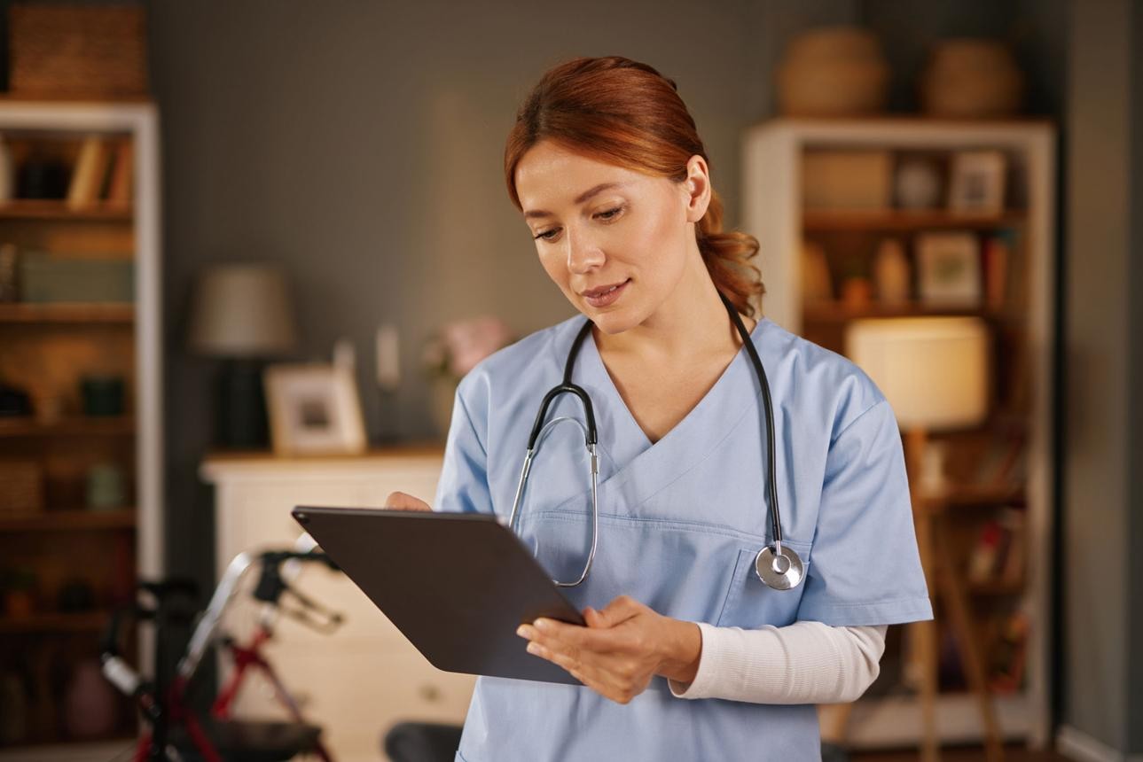 Nurse providing compassionate care to a patient at home