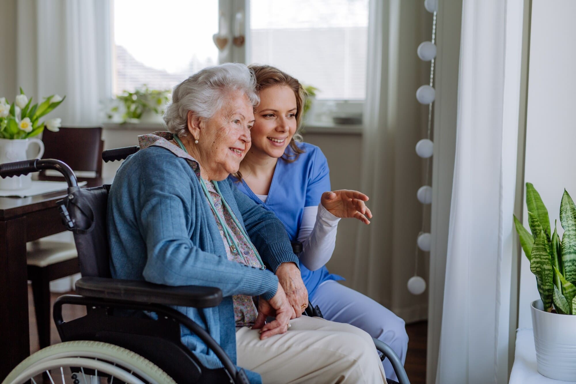 Senior receiving personalized in-home care and daily living assistance