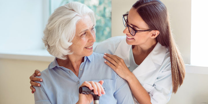 Companion caregiver sharing a warm moment with a senior at home in McKinney