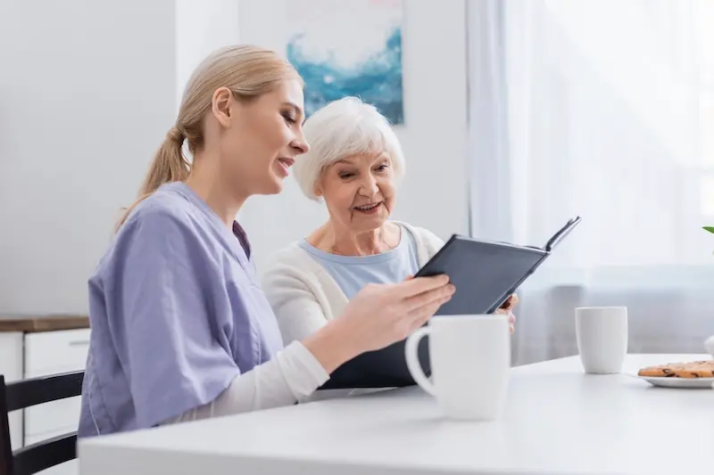Senior enjoying familiar home surroundings with caregiver support