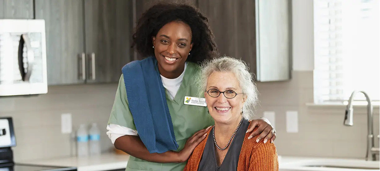 Companion caregiver helping a senior with daily living at home in Plano