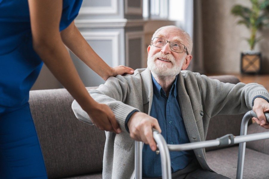 Caregiver assisting senior with daily living activities