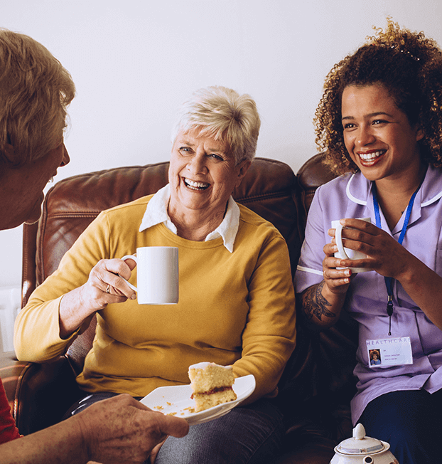 A caregiver gently brushing a senior's hair, providing personalized one-on-one care