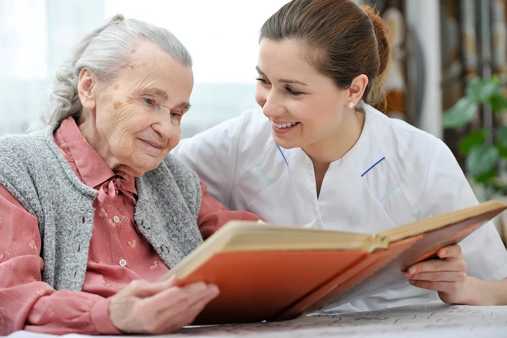 Nurse and client reviewing a personalized delegation care plan together