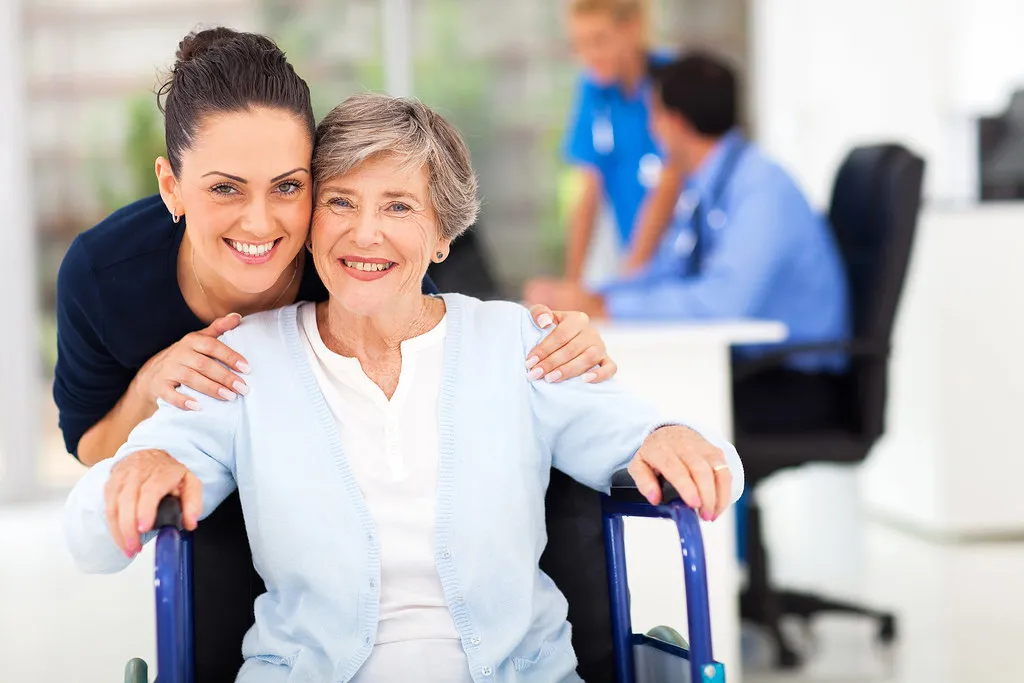 Family caregiver and senior reviewing care instructions together