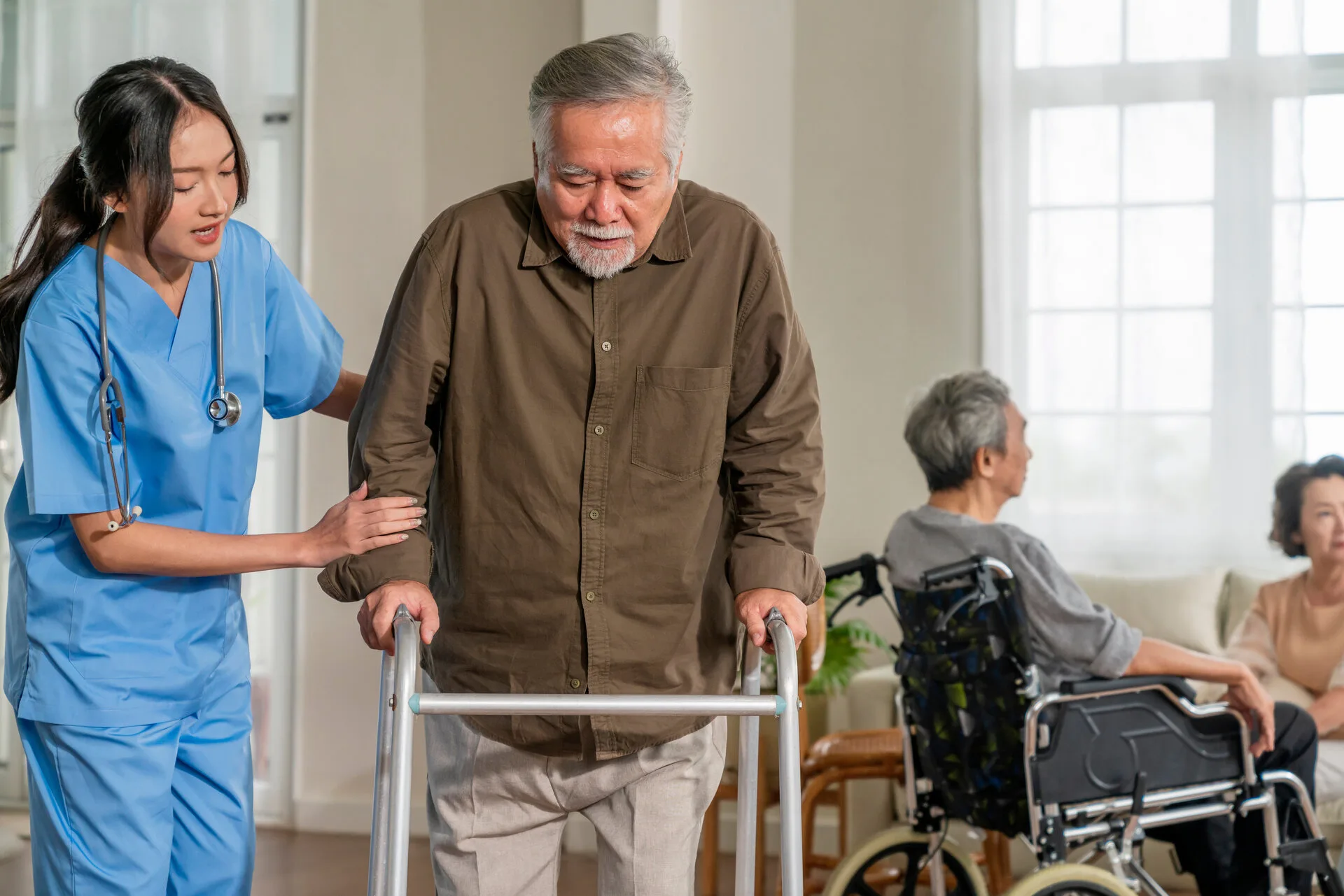 Caregiver assisting a senior with a walker for safe mobility
